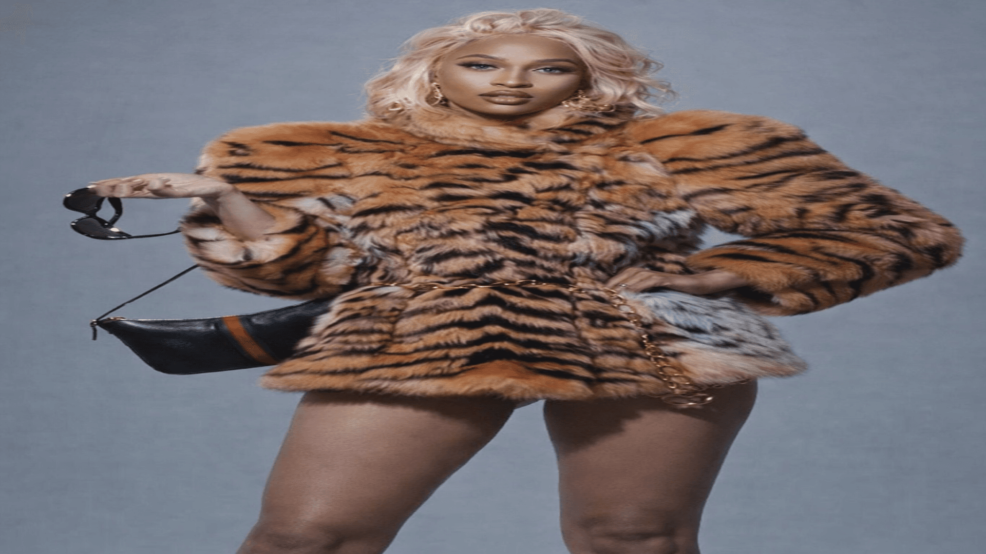GODDE$$ in tiger print fur